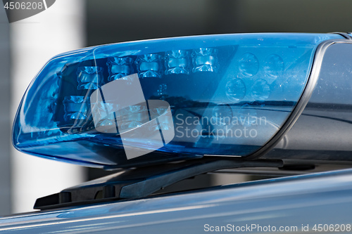 Image of Detail shot of a blue light on a police car