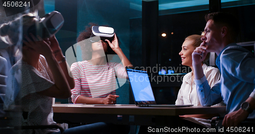 Image of Multiethnic Business team using virtual reality headset