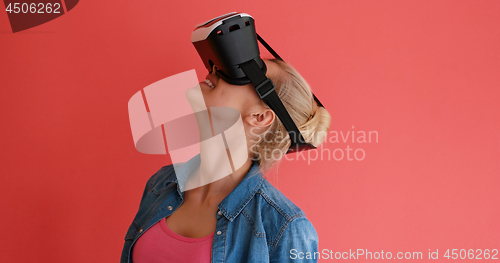 Image of young girl using VR headset glasses of virtual reality