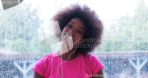 Image of portrait of young afro american woman in gym