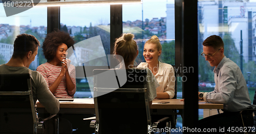 Image of Multiethnic startup business team in night office