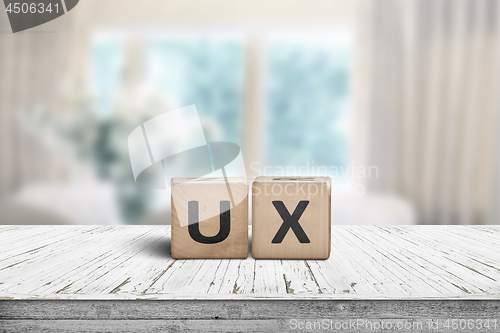 Image of UX development sign on a table in a bright room