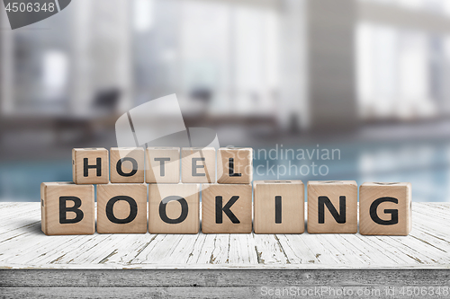 Image of Hotel booking sign on a wooden step