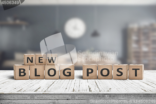 Image of New blog post sign on a wooden desk