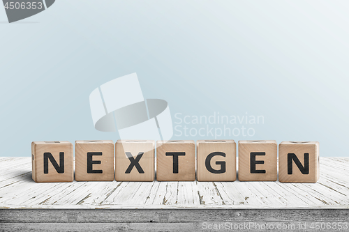 Image of NextGen sign on a plank desk