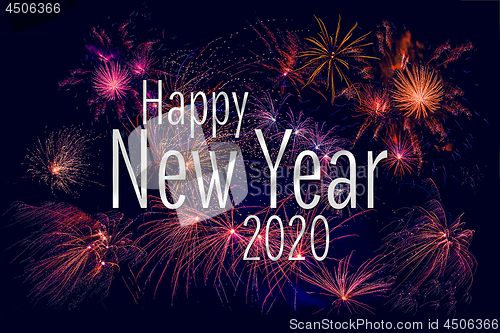 Image of Happy New Year 2020 greeting with colorful fireworks