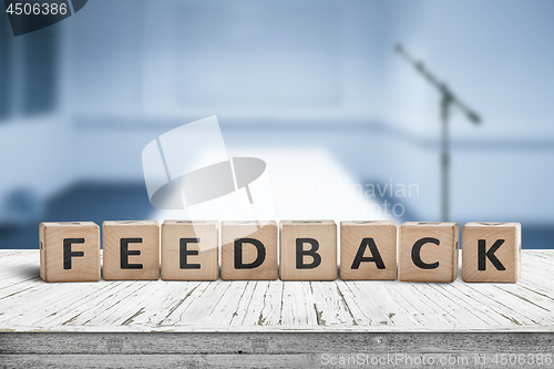 Image of Feedback word on wooden cubics in a blue room