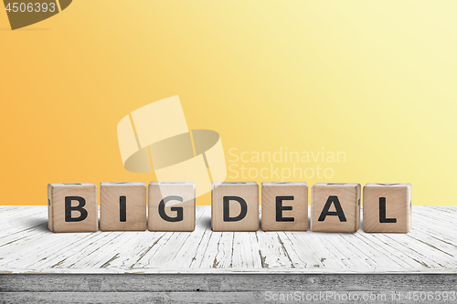 Image of Big deal sign made of wooden cubes on a desk