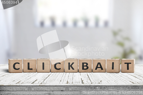 Image of Clickbait word on a wooden sign