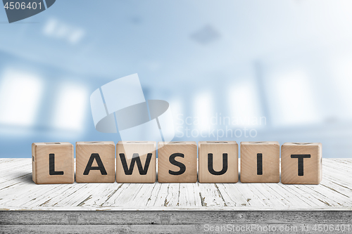 Image of Lawsuit sign on a wooden table