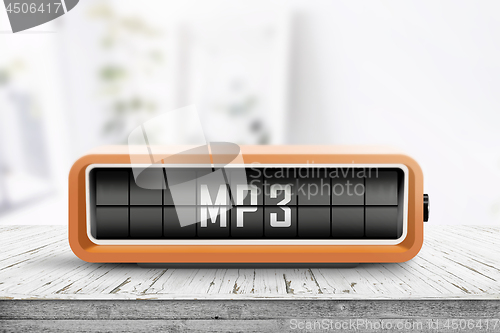 Image of Mp3 message on a analog device in a bright room
