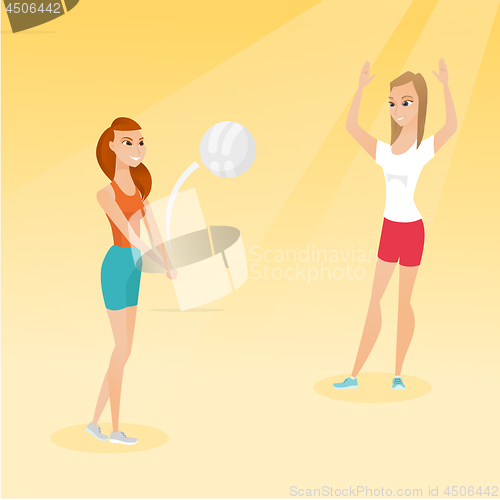 Image of Two caucasian women playing beach volleyball.