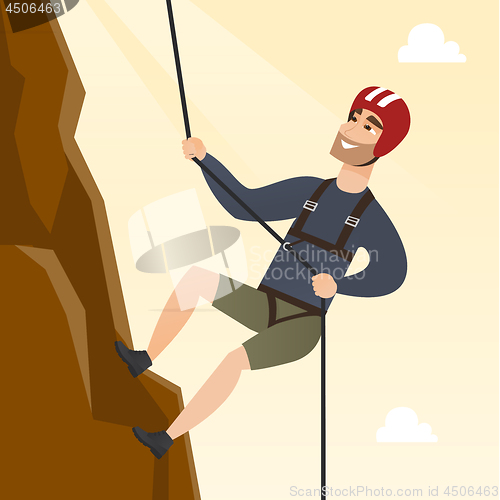 Image of Young caucasian man climbing a mountain with rope.