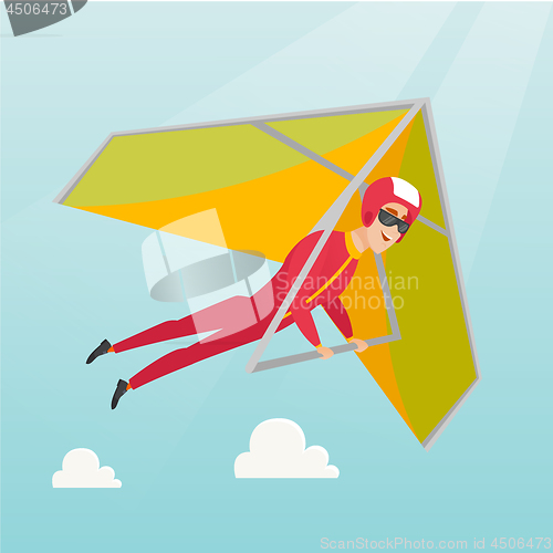 Image of Young caucasian man flying on hang-glider.