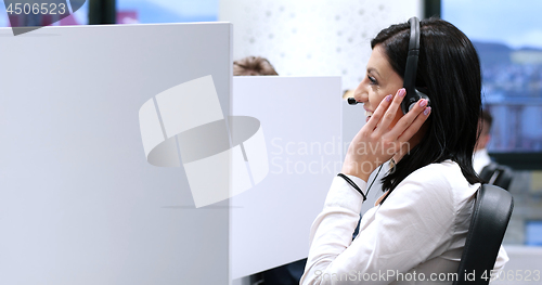 Image of female call centre operator doing her job