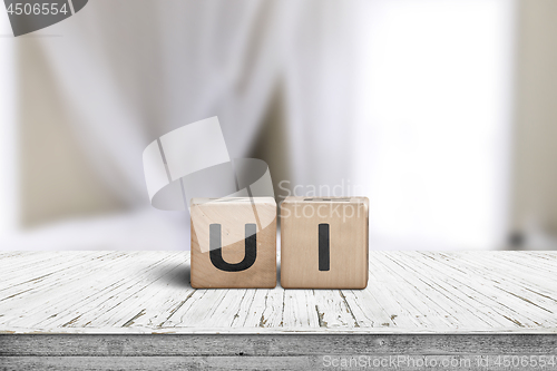 Image of UI development sign on a desk in a room