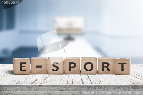 Image of E-sport sign on a desk in a blue room