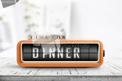 Image of Time for dinner message on a wooden table