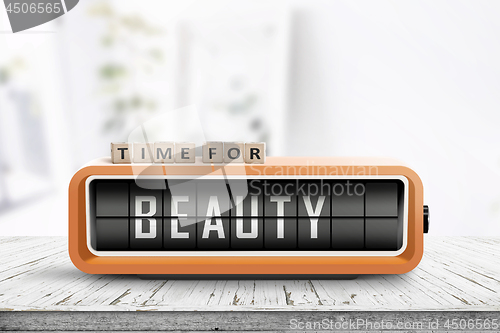 Image of Time for beauty message on a retro alarm clock