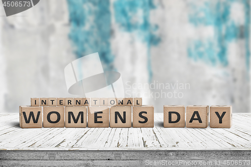 Image of International Womens day sign on a wooden table