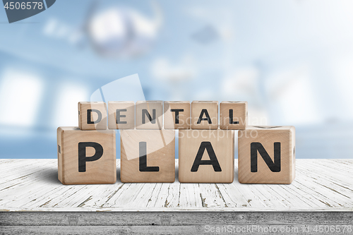 Image of Dental plan sign with a blue room in the background