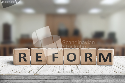 Image of Reform sign on a desk with a blurry background