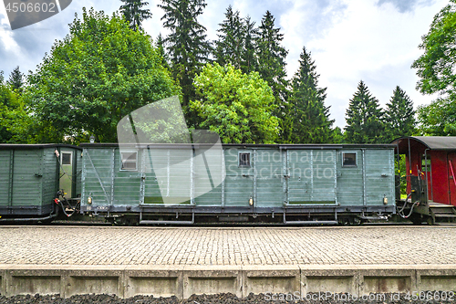 Image of Train wagon with cargo on a railway at a station