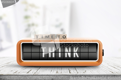 Image of Time to think text on an old alarm clock