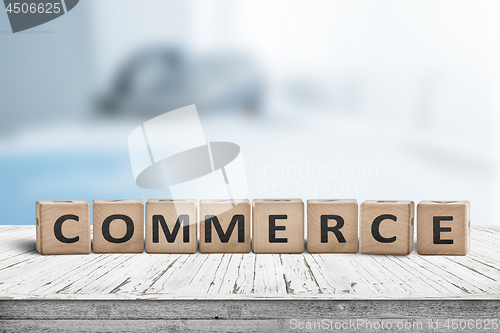 Image of Commerce word on a wooden cube sign