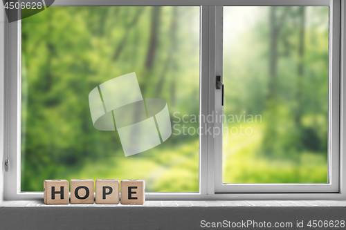 Image of Hope sign in a window sill with a view