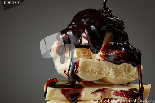 Image of syrop pouring onto a piece of chocolate