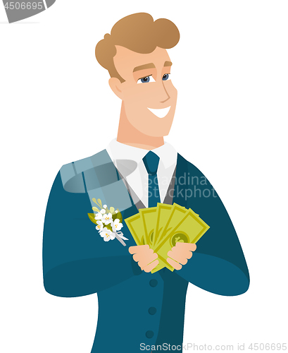 Image of Young caucasian groom holding money.