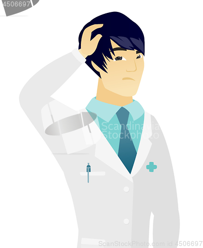 Image of Young asian puzzled doctor scratching his head.