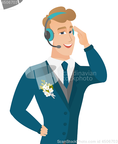 Image of Young caucasian groom in headset.