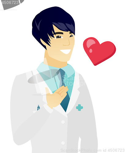 Image of Young asian doctor holding hand on his chest.