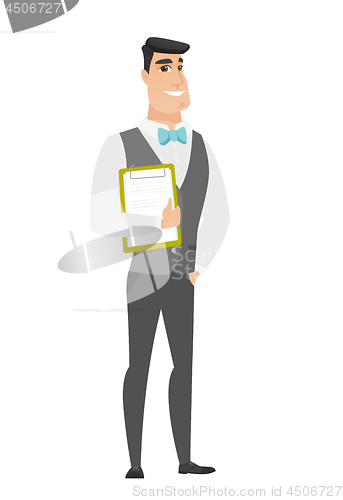 Image of Groom holding clipboard with documents.