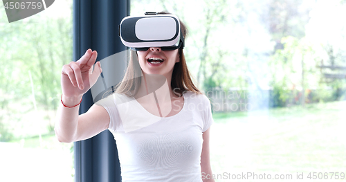 Image of woman using VR-headset glasses of virtual reality