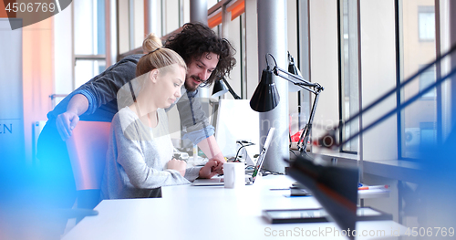 Image of Business People Working With laptop in office