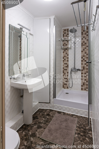 Image of The interior of a small bathroom with toilet