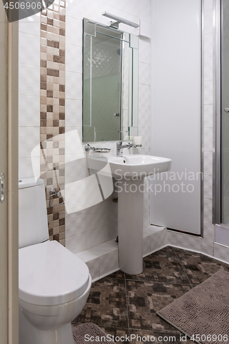 Image of Interior of the combined toilet and bathroom in a small apartment