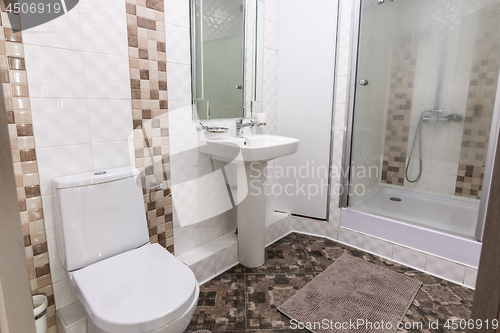 Image of The interior of the toilet and bathroom with shower