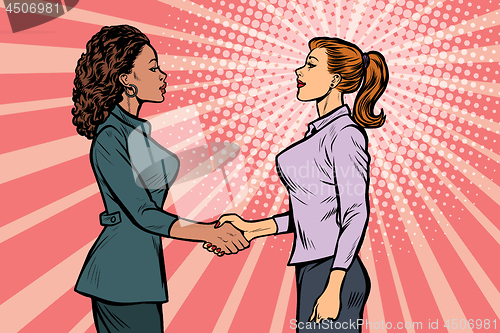 Image of two businesswomen shaking hands