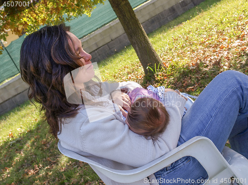 Image of Woman breastfeeding baby