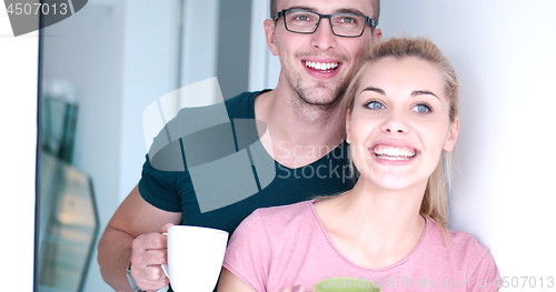 Image of young couple enjoying morning coffee