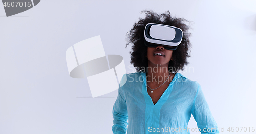 Image of black girl using VR headset glasses of virtual reality