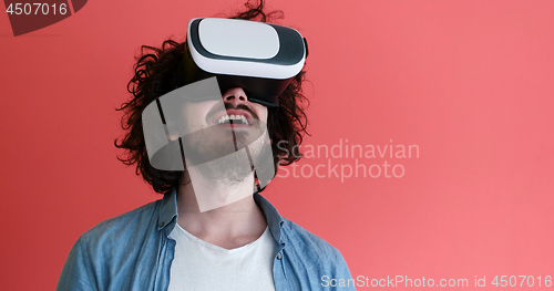 Image of young man using VR headset glasses of virtual reality