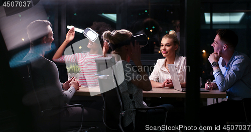 Image of Multiethnic Business team using virtual reality headset