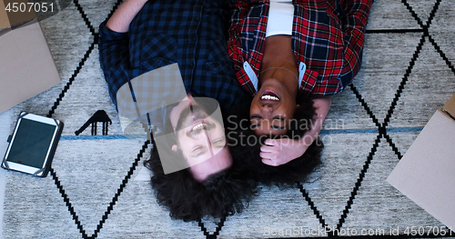 Image of Top view of attractive young multiethnic couple