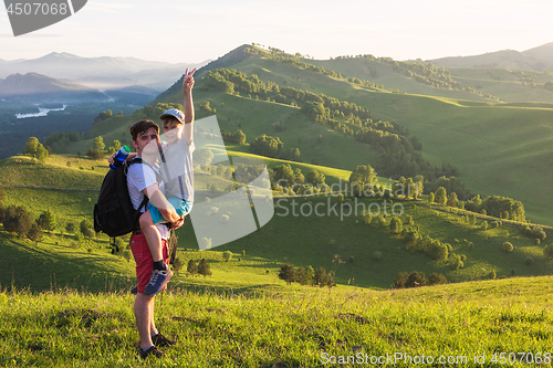 Image of Happy father and son in the Altai mountains