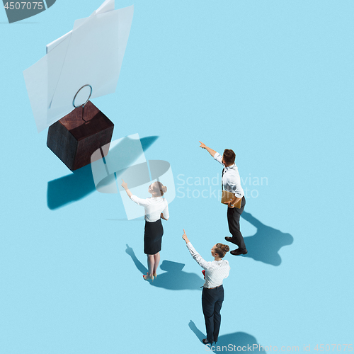 Image of Flat isometric view of businessmen and woman showing at blank sheets of paper with empty copy space